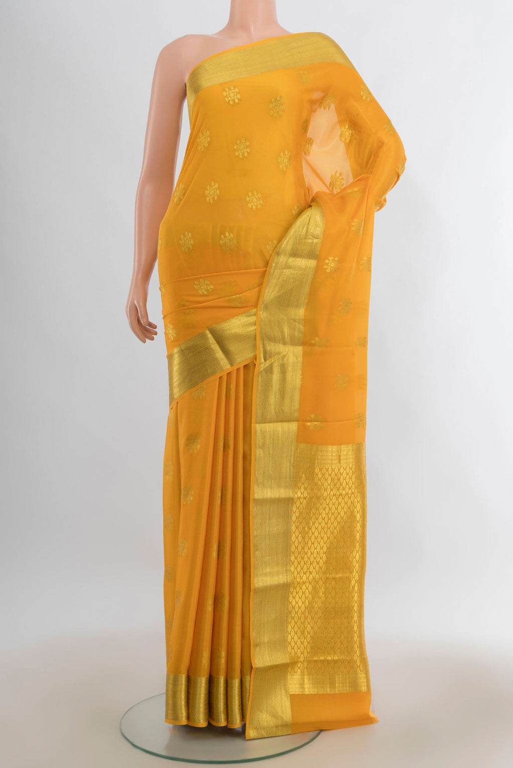 Yellow Mysore Crepe Saree with Zari Butta on the body and Zari Border.  displayed on a mannequin