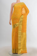 Yellow Mysore Crepe Saree with Zari Butta on the body and Zari Border.  displayed on a mannequin