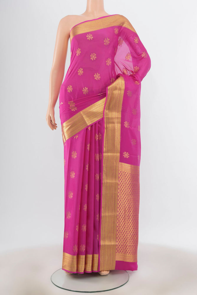 Magenta Mysore Silk Saree with Zari Butta on the body and Silk Border.  displayed on a mannequin