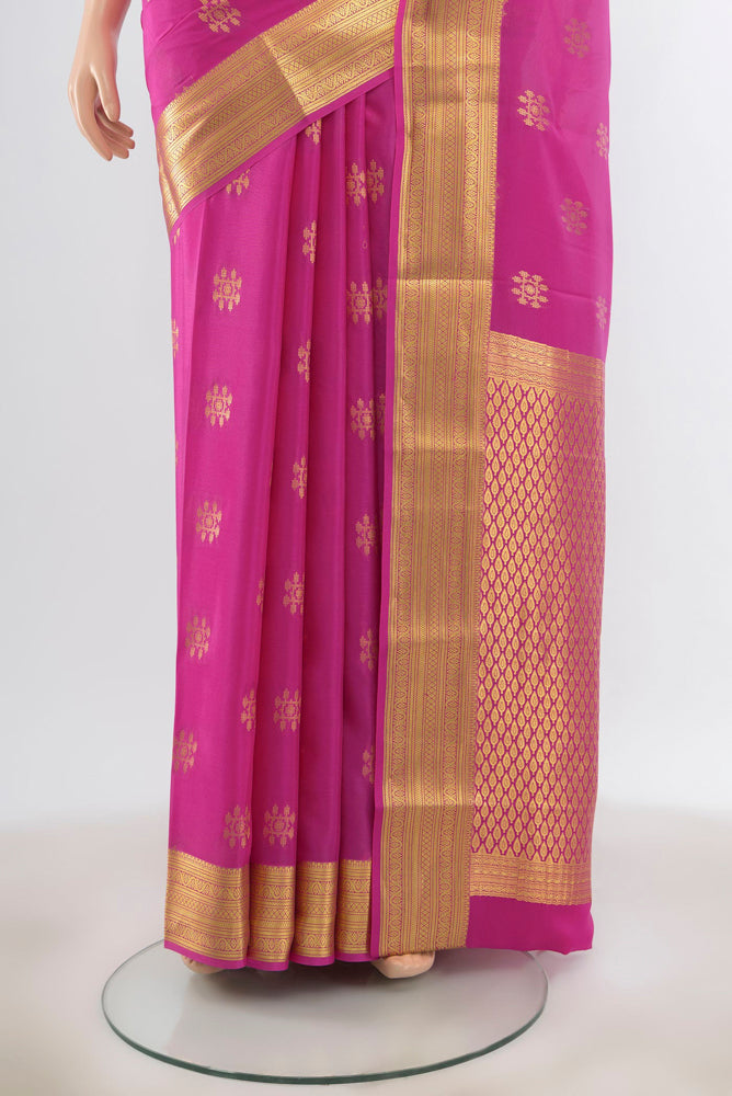 Pleats and pallu of Magenta Mysore Silk Saree with Zari Butta on the body and Silk Border. 