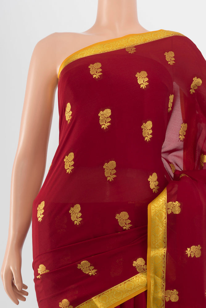 Border image of Maroon Georgette Saree with Zari Butta on the body and Silk Border. 