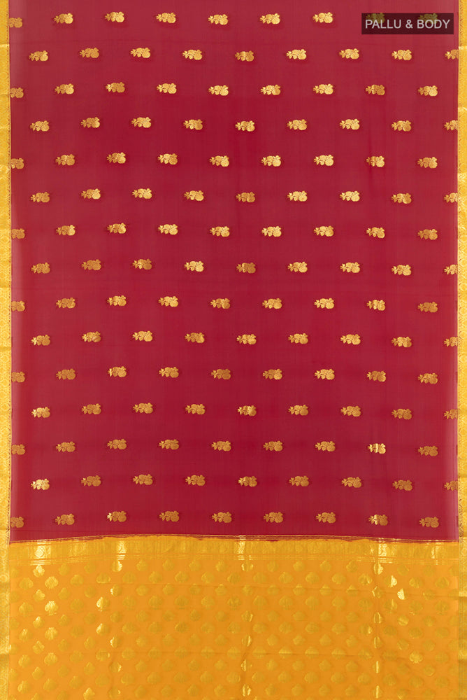 Flat view of Maroon Georgette Saree with Zari Butta on the body and Silk Border. 
