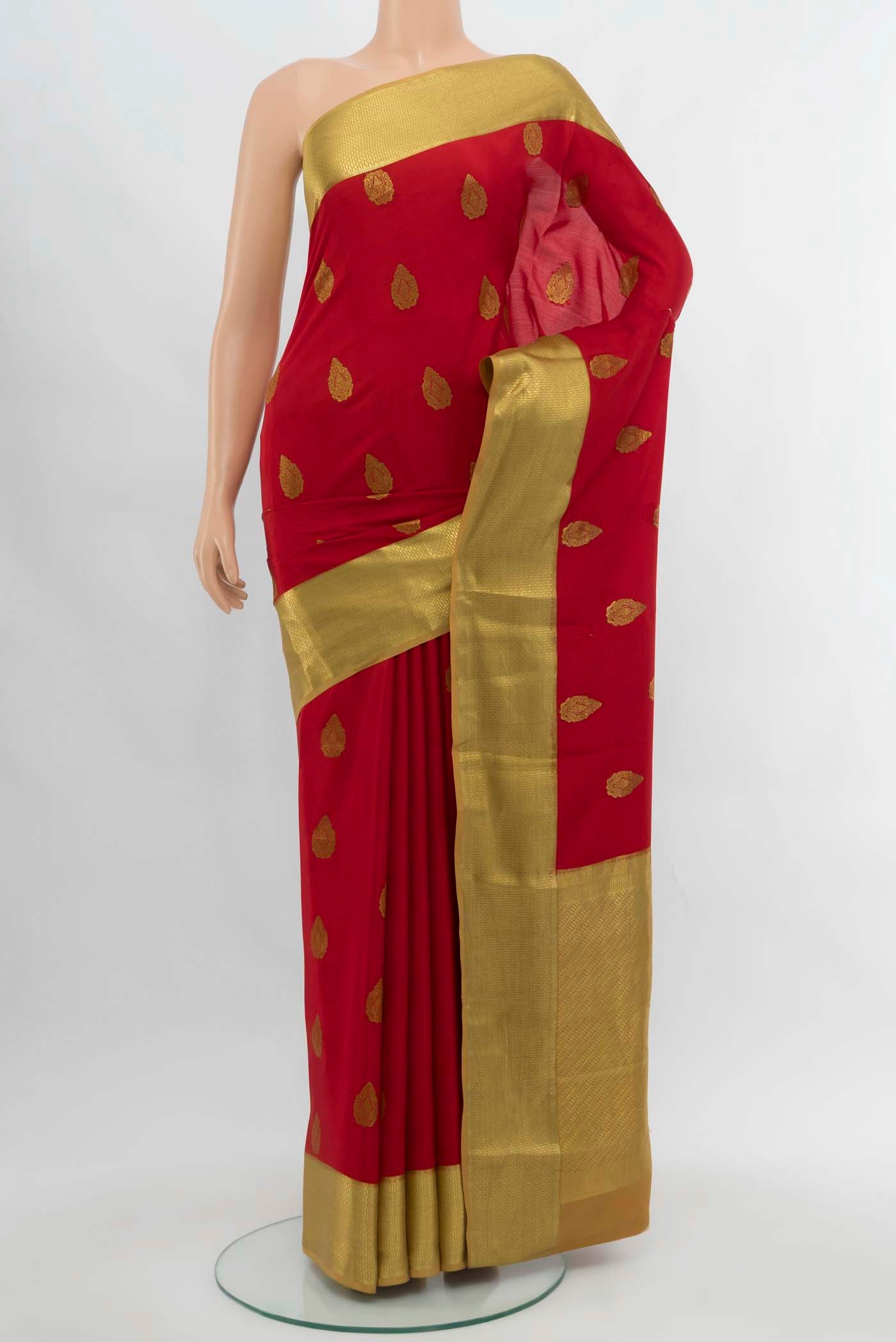 Red Mysore Crepe Saree with Zari Butta on the body and Silk Border.  displayed on a mannequin