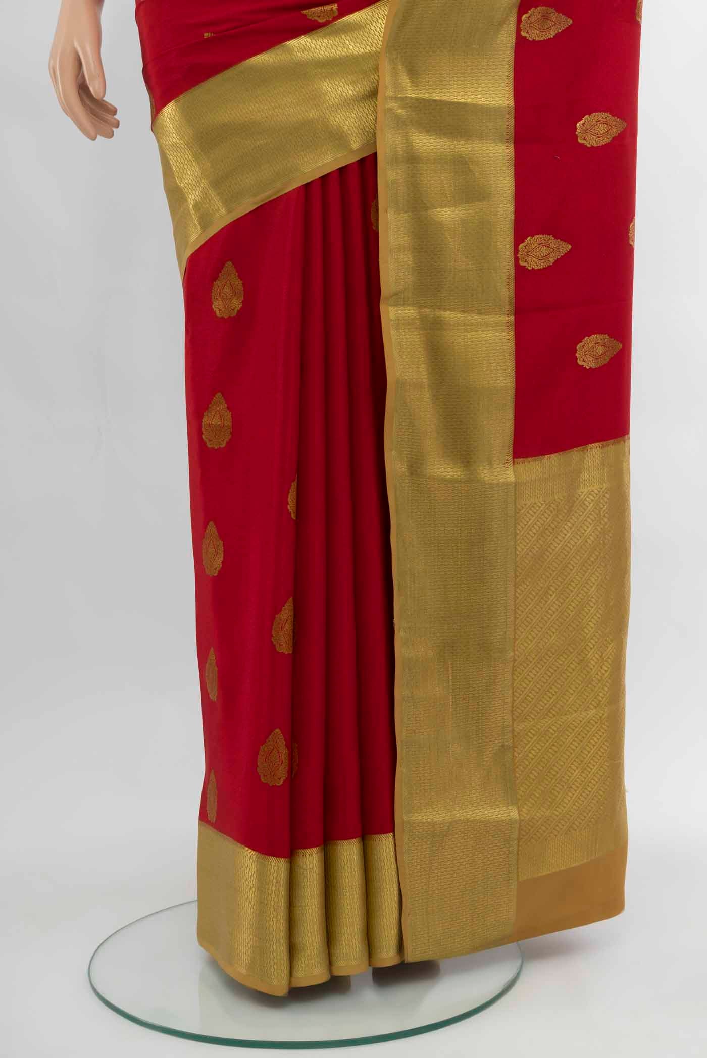 Pleats and pallu of Red Mysore Crepe Saree with Zari Butta on the body and Silk Border. 