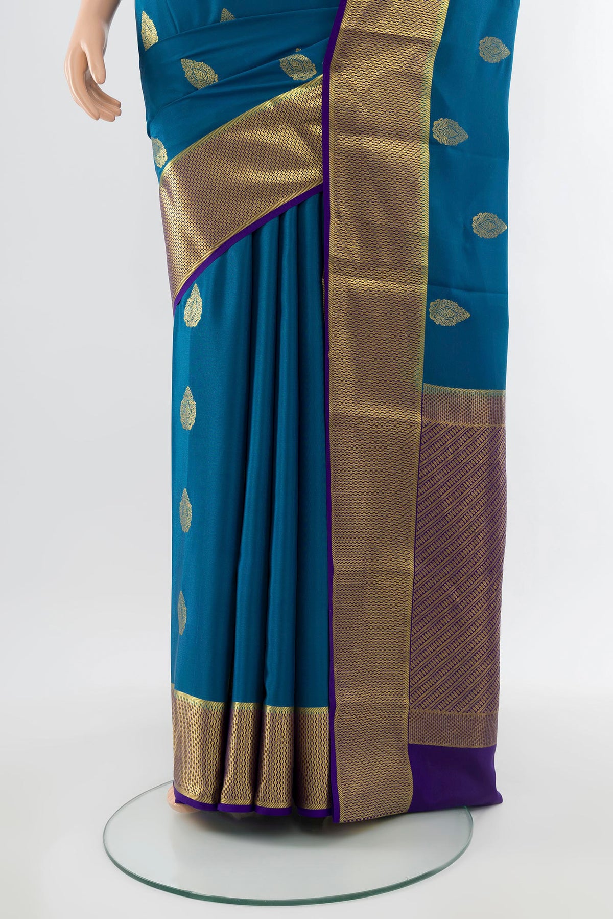 Pleats and pallu of Dark Blue Mysore Crepe Saree with Zari Butta on the body and Silk Border. 