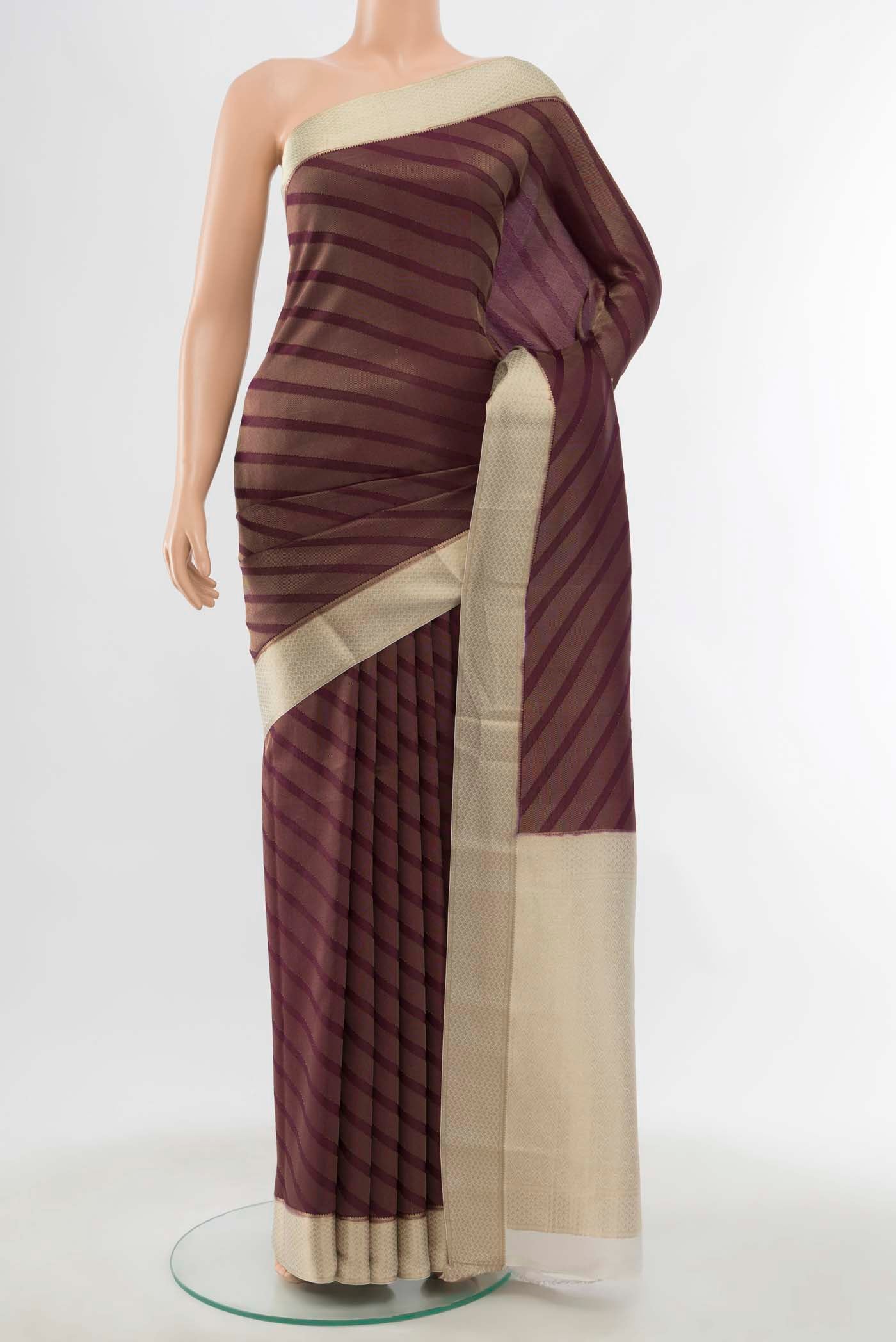 Purple Mysore Crepe Saree with Stripes on the body and Zari Border displayed on a mannequin