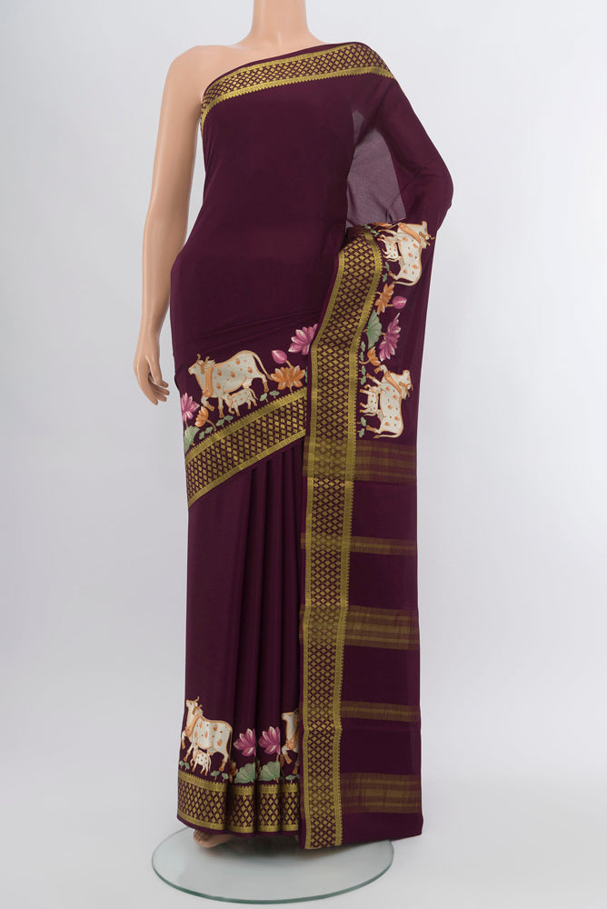 Coffee Brown Mysore Crepe Saree with Zari Butta on the body and Silk Border.  displayed on a mannequin