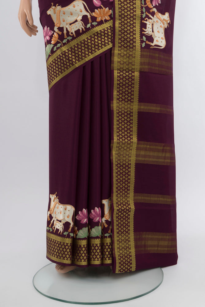 Pleats and pallu of Coffee Brown Mysore Crepe Saree with Zari Butta on the body and Silk Border. 