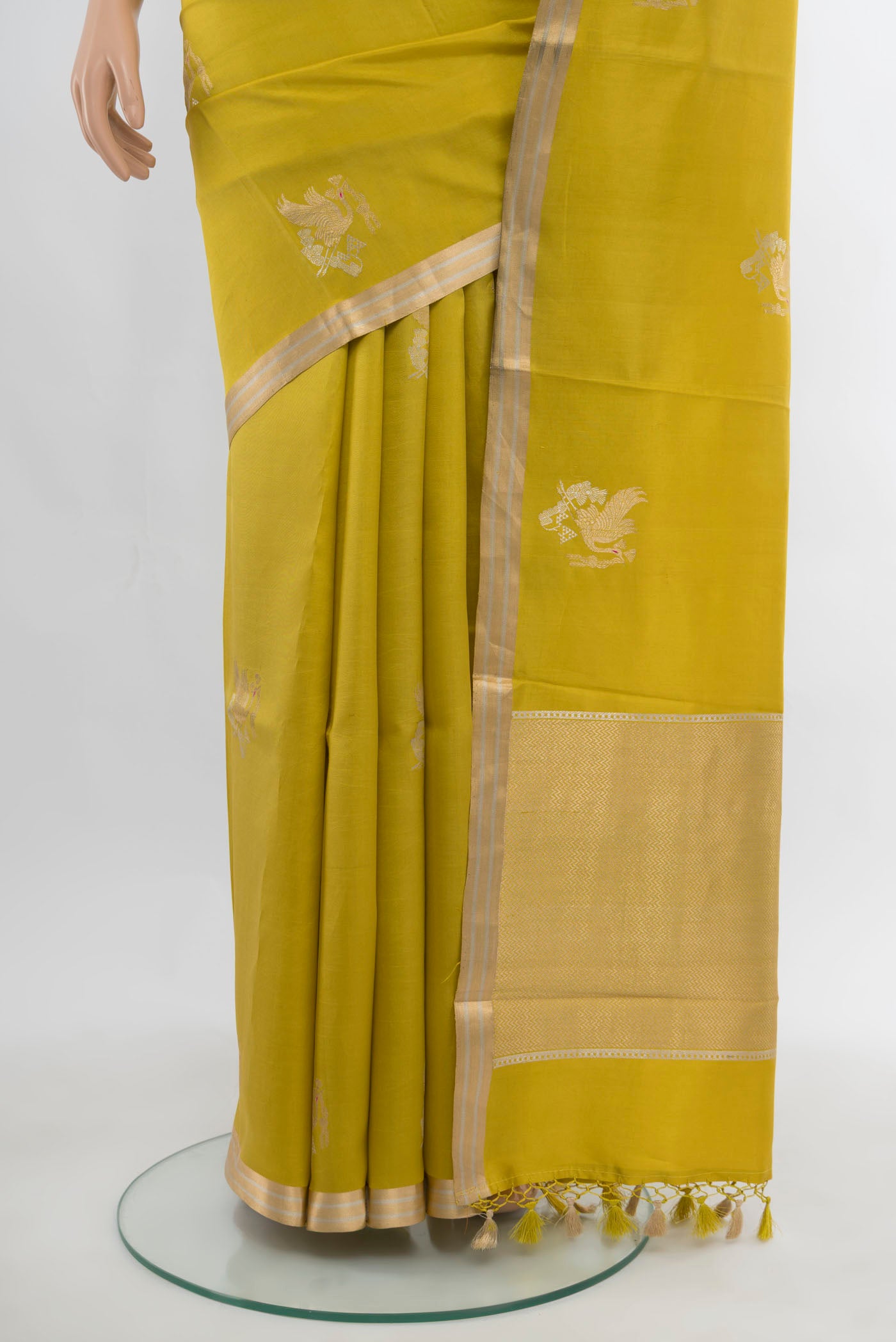 Pleats and pallu of Light Green Banarasi Katan Silk Saree with Zari Butta on the body and Silk Border. 