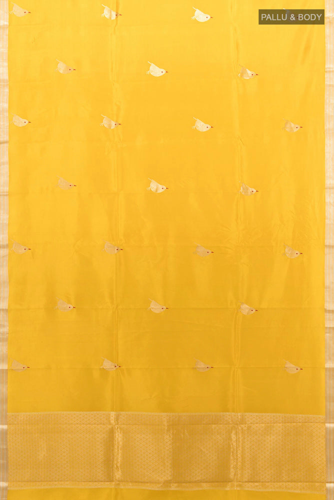 Flat view of Yellow Banarasi Katan Silk Saree with Zari Butta on the body and Silk Border. 