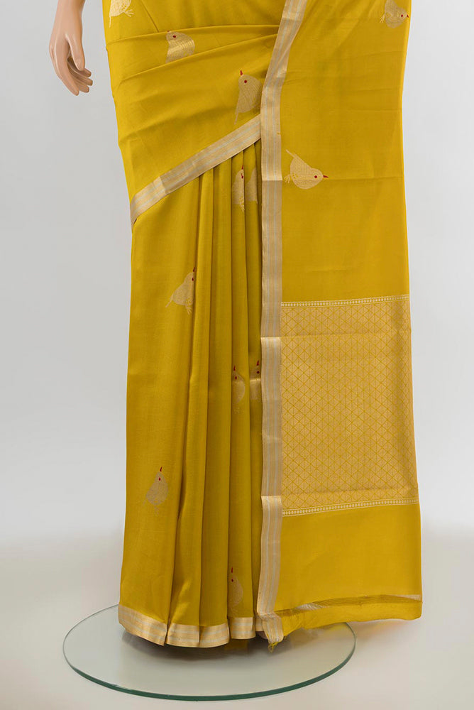 Pleats and pallu of Yellow Banarasi Katan Silk Saree with Zari Butta on the body and Silk Border. 
