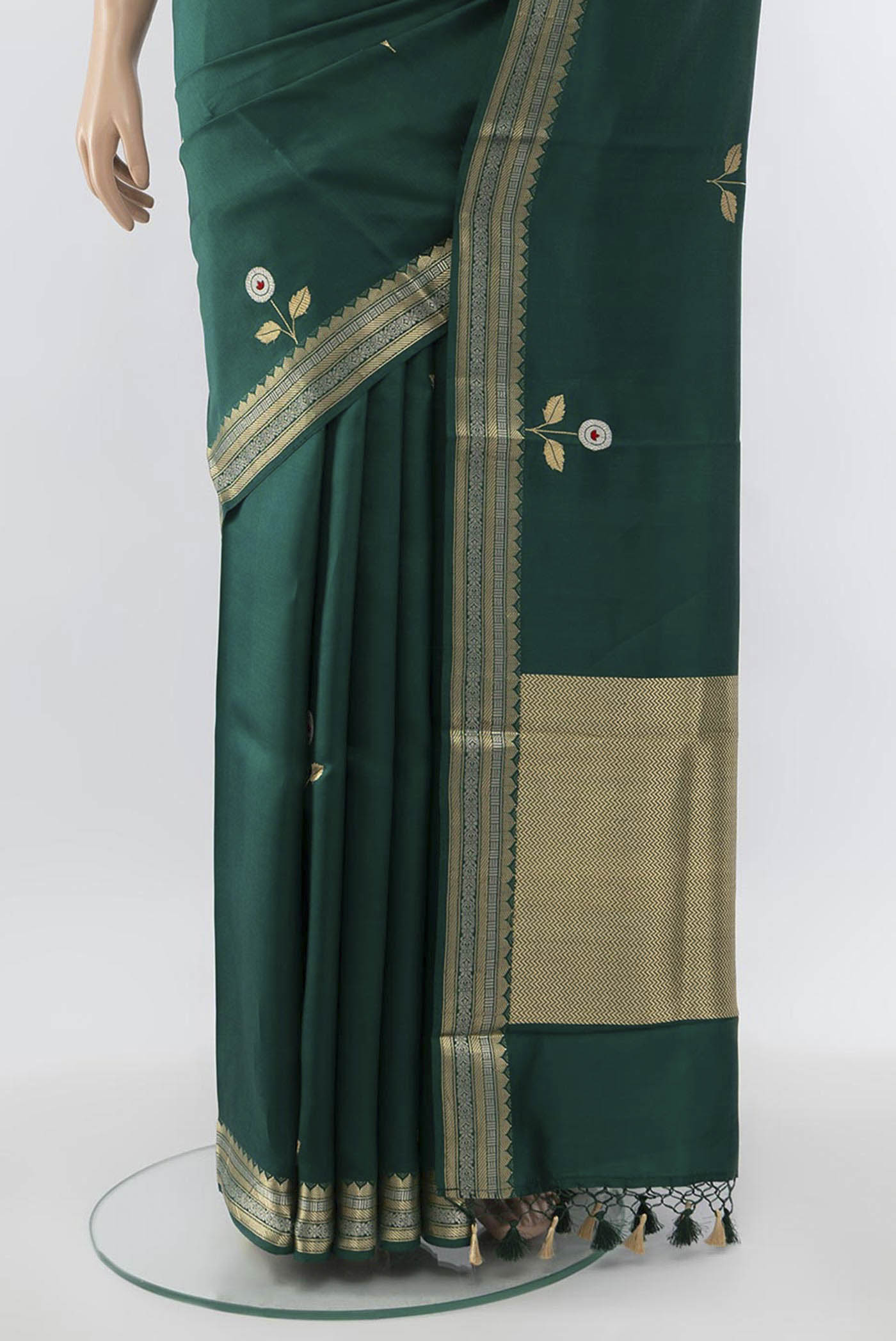 Pleats and pallu of Bottle Green Banarasi Katan Silk Saree with Zari Butta on the body and Zari Border. 