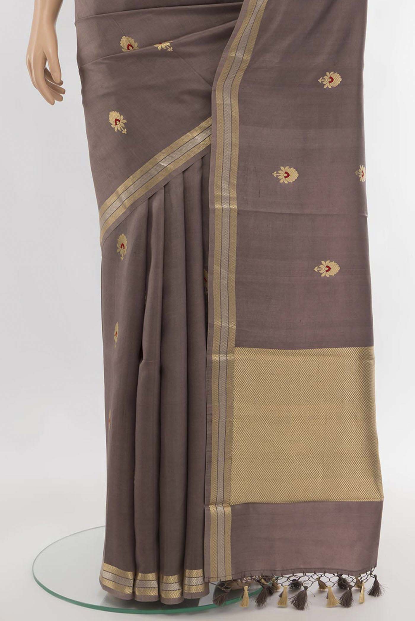 Pleats and pallu of Dark Beige Banarasi Katan Silk Saree with Zari Butta on the body and Silk Border. 