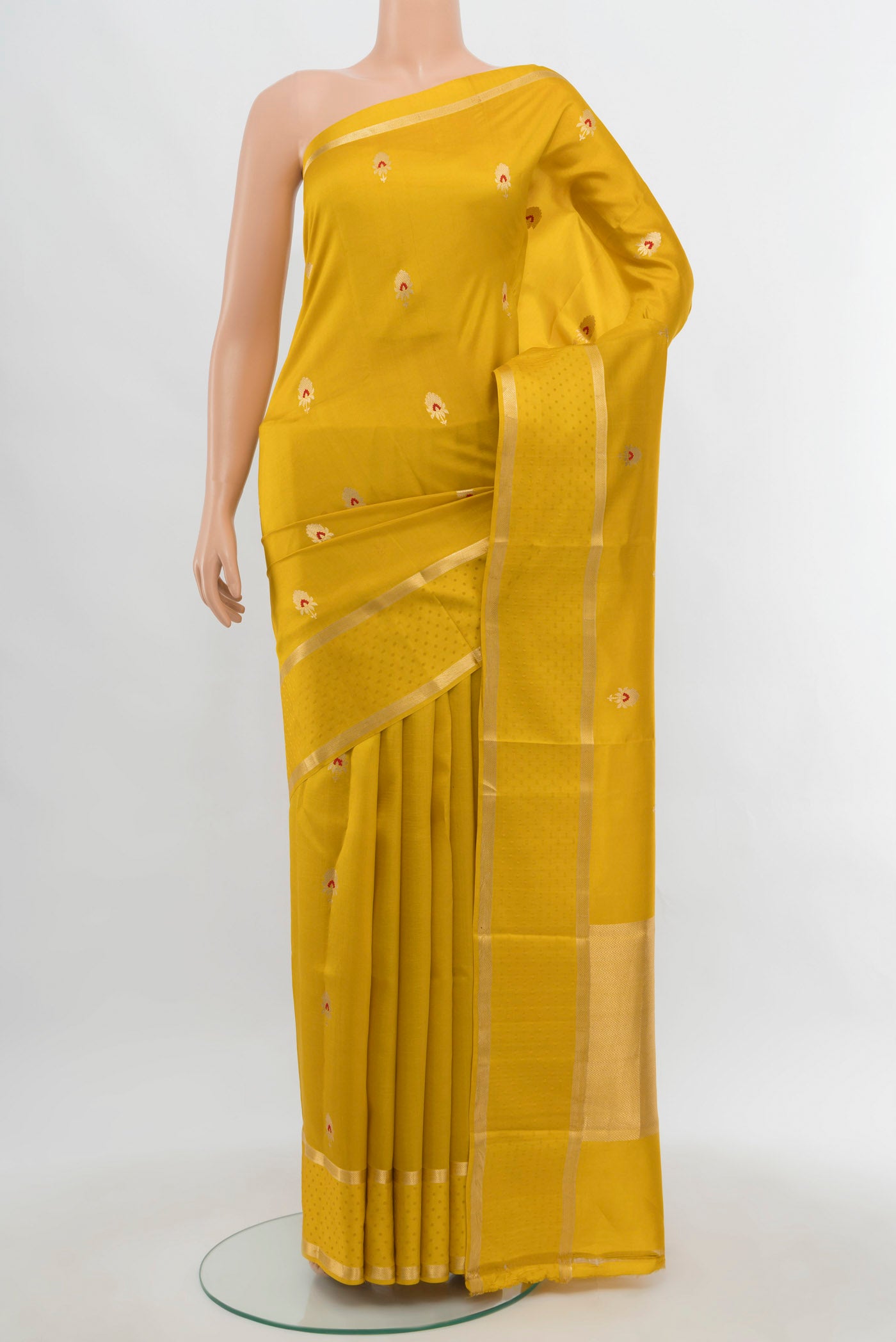 Yellow Banarasi Katan Silk Saree with Zari Butta on the body and Silk Border.  displayed on a mannequin