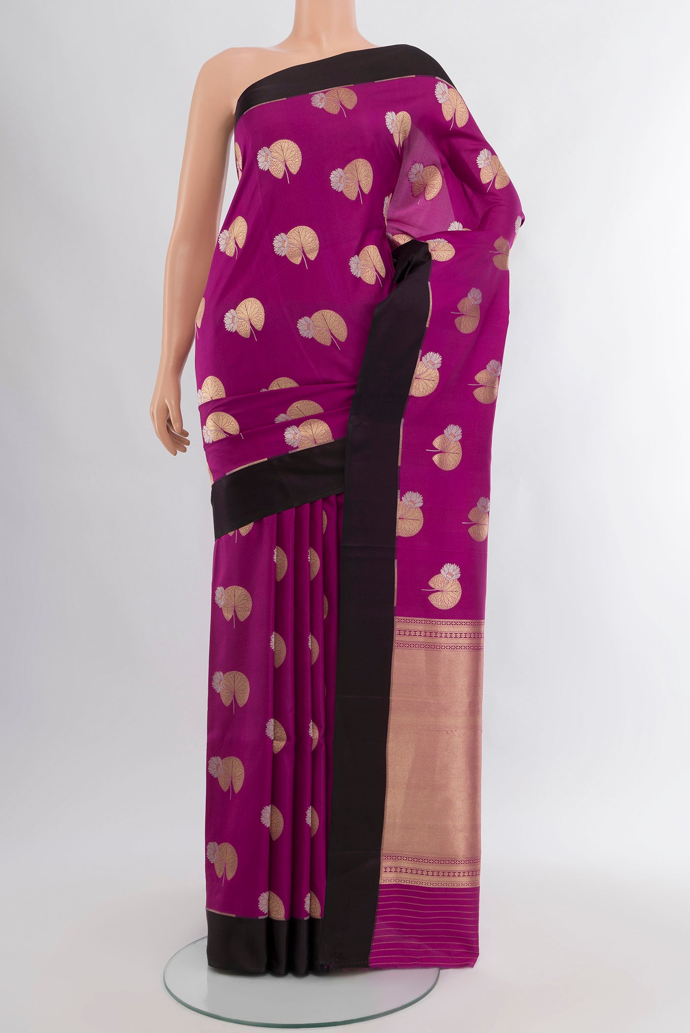 Purple Banarasi Katan Silk Saree with Zari Butta on the body and Fancy Border.  displayed on a mannequin