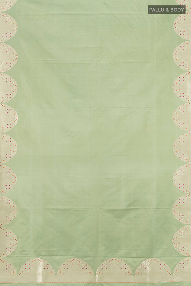 Flat view of Pure Silk Pure Zari Pista Green Banarasi Saree with Zari Butta on the body and Silk Border. 