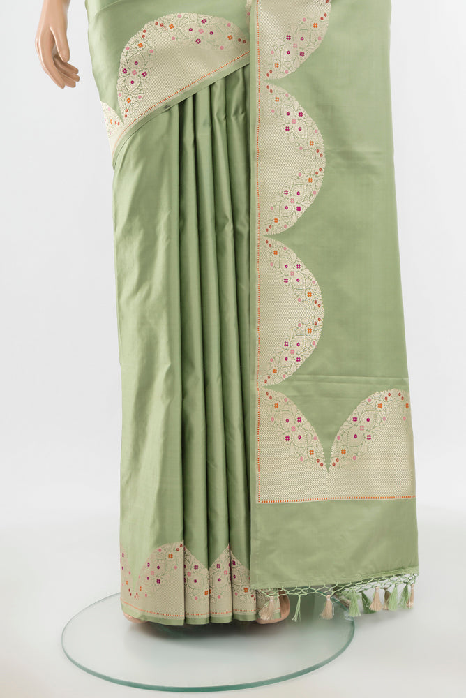 Pleats and pallu of Pure Silk Pure Zari Pista Green Banarasi Saree with Zari Butta on the body and Silk Border. 