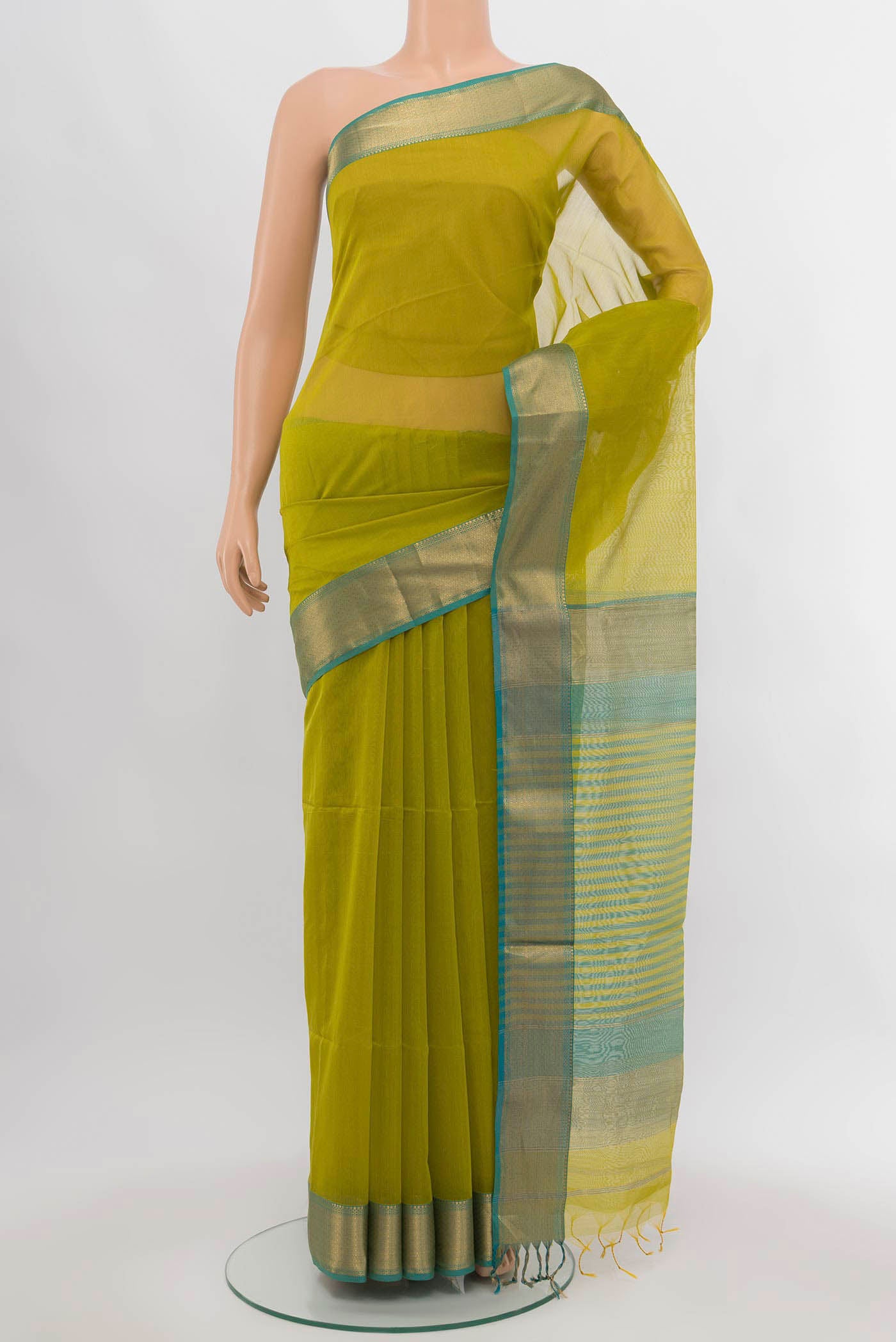 Parrot Green Maheshwari Silk Cotton Saree with Zari Butta on the body and Silk Border.  displayed on a mannequin