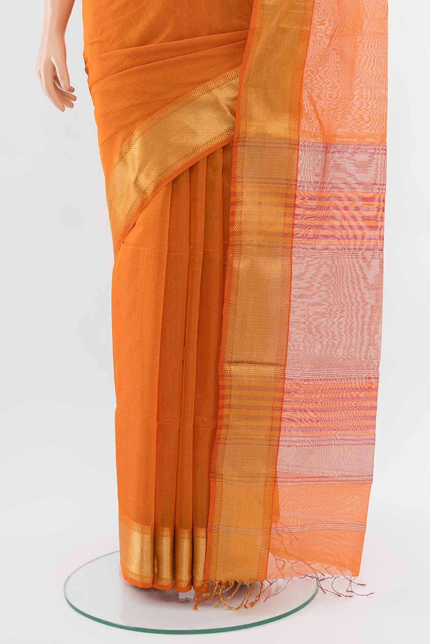 Pleats and pallu of Orange Maheshwari Silk Cotton Saree with Zari Butta on the body and Silk Border