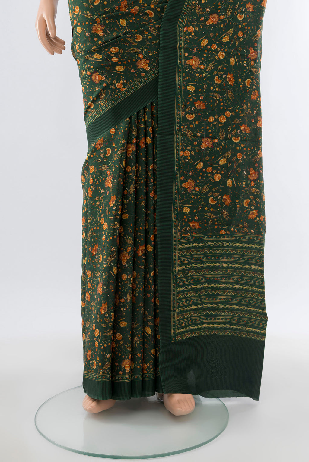 Pleats and pallu of Bottle Green Printed Silk Saree with Floral Print on the body and Silk Border. 