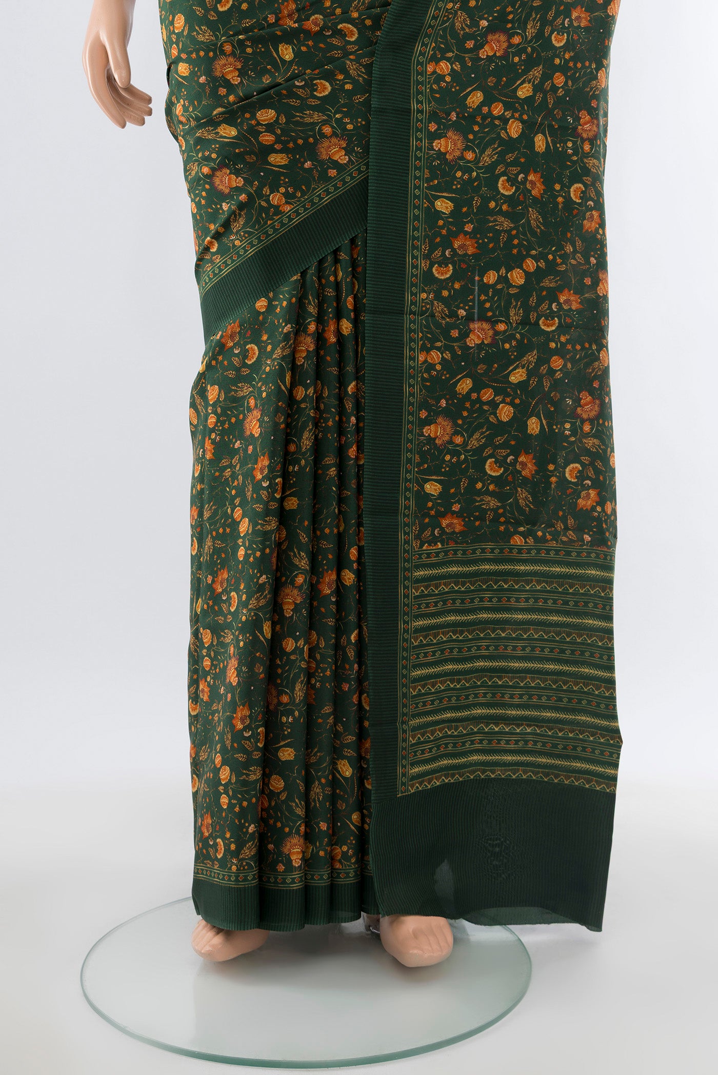 Pleats and pallu of Bottle Green Printed Silk Saree with Floral Print on the body and Silk Border. 