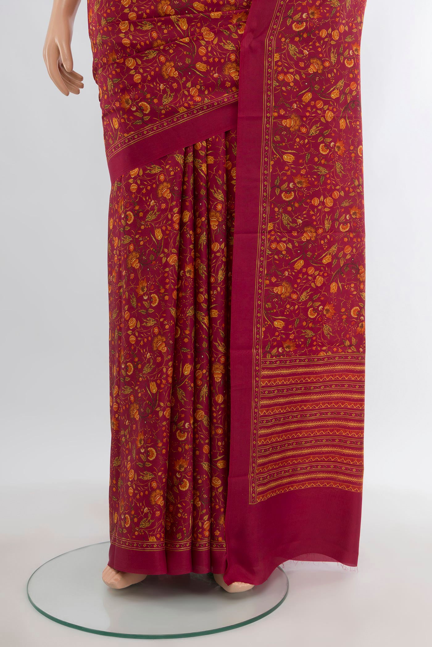 Pleats and pallu of Red Printed Silk Saree with Floral Print on the body and Printed Border. 