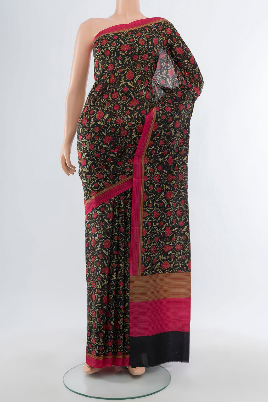Black Printed Silk Saree with Floral Print on the body and Printed Border.  displayed on a mannequin