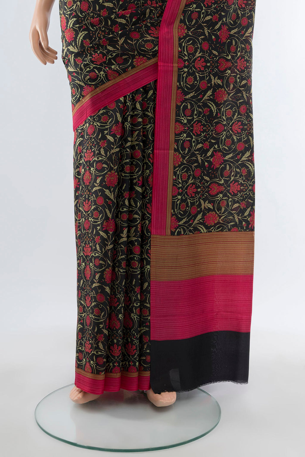Pleats and pallu of Black Printed Silk Saree with Floral Print on the body and Printed Border. 