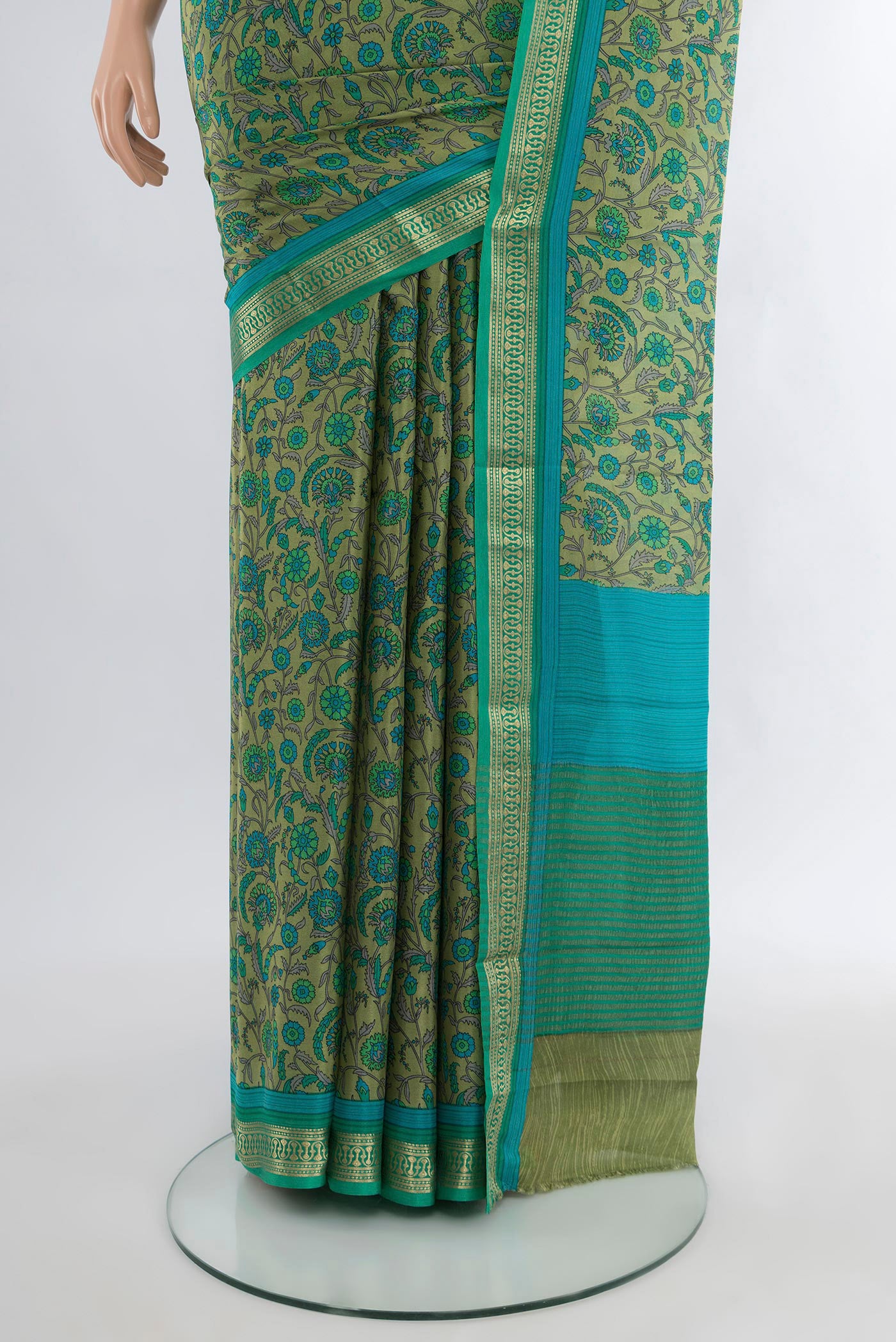 Pleats and pallu of Sage Green Mysore Crepe Saree with Floral Print on the body and Zari Border. 
