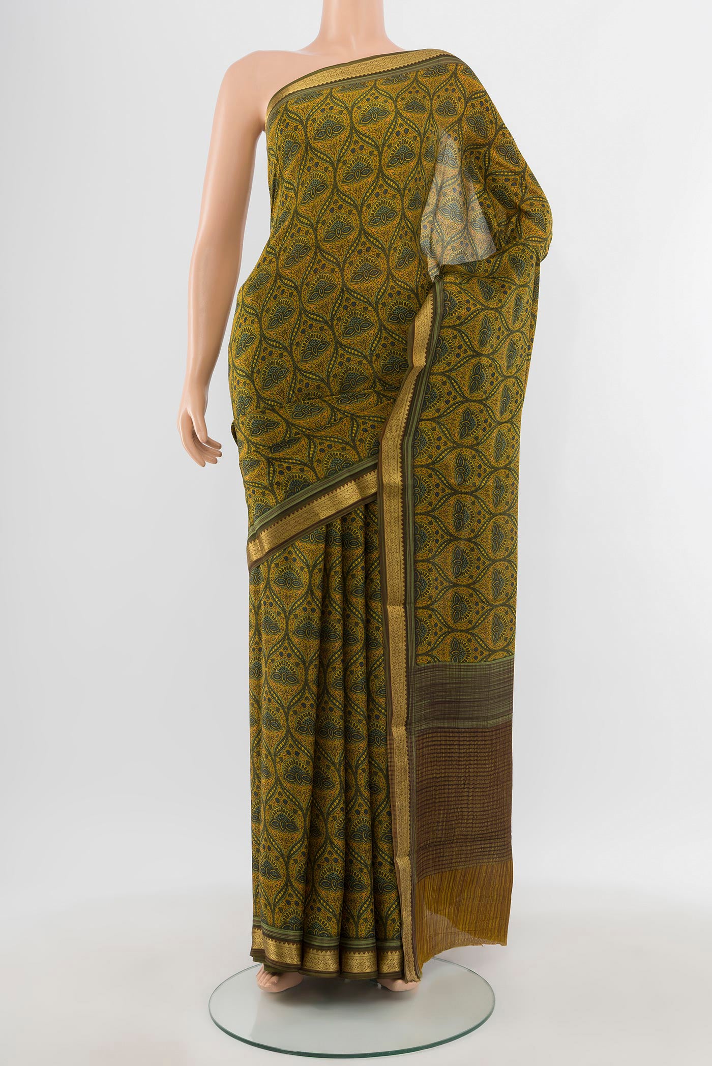Mustard Mysore Crepe Saree with Floral Print on the body and Zari Border.  displayed on a mannequin