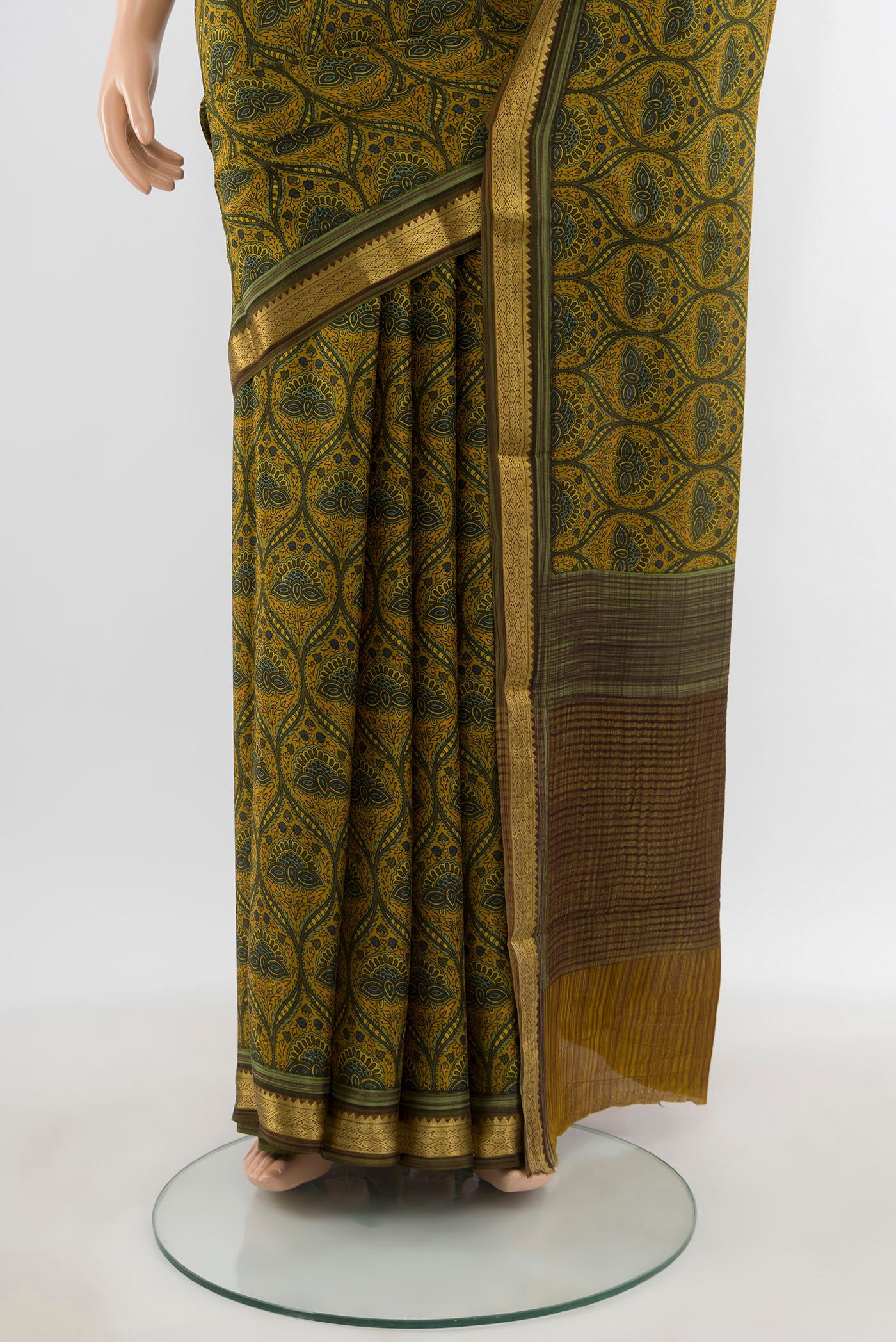 Pleats and pallu of Mustard Mysore Crepe Saree with Floral Print on the body and Zari Border. 
