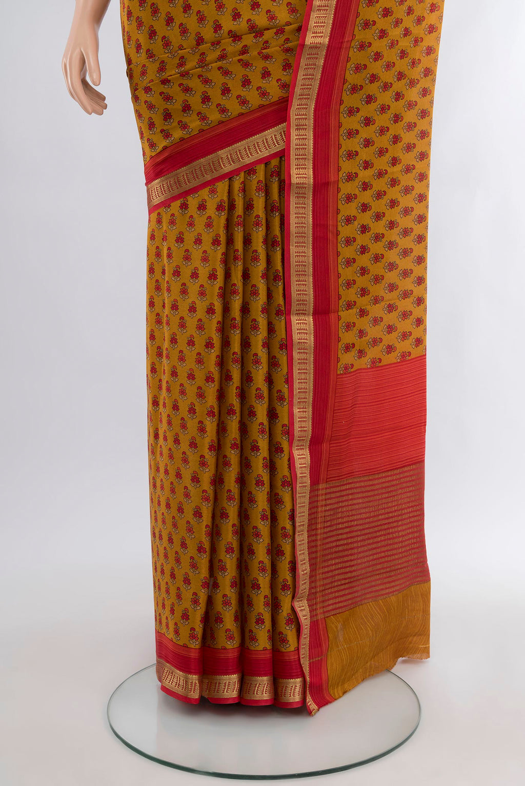 Pleats and pallu of Mustard Mysore Crepe Saree with Floral Print on the body and Zari Border. 