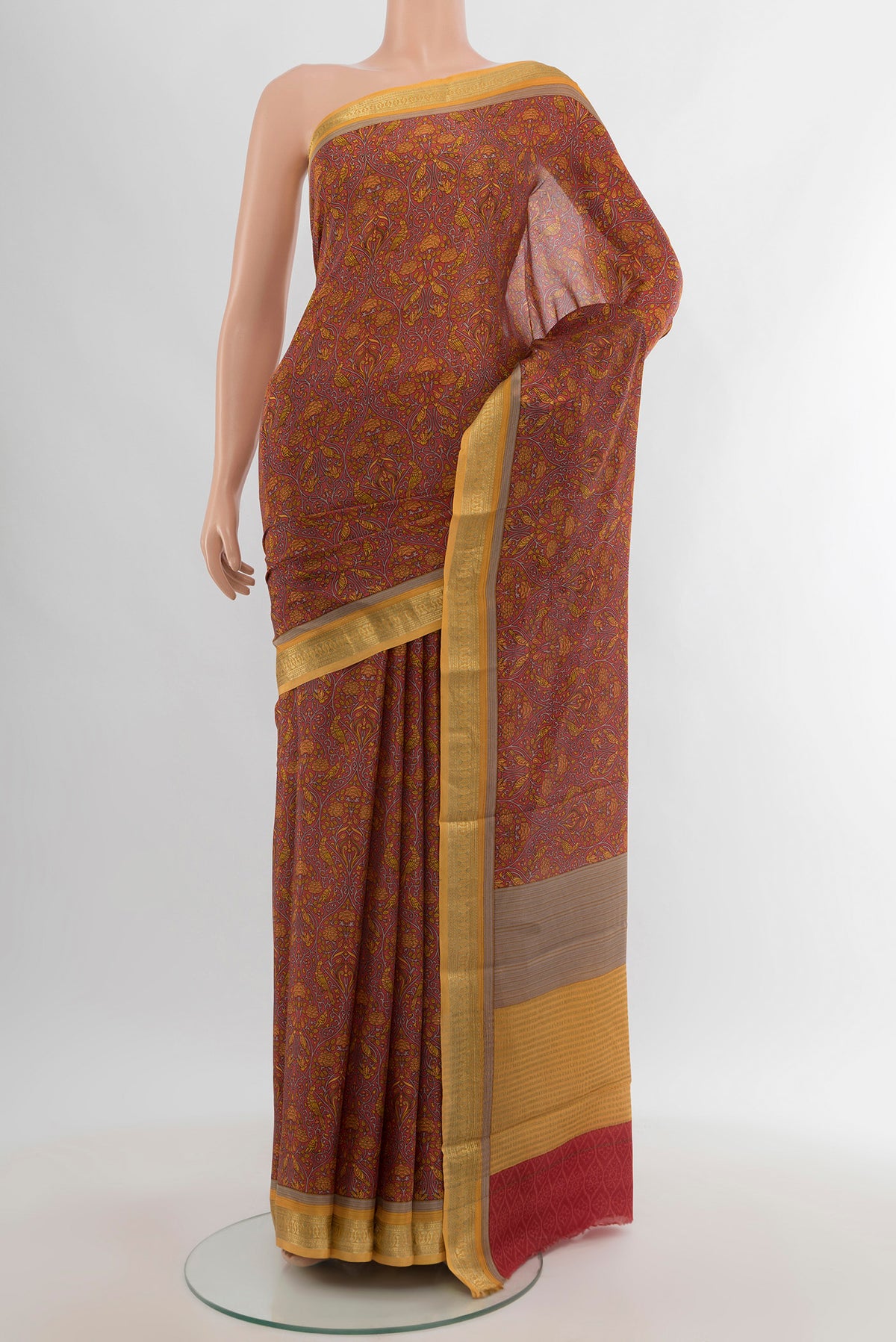 Coral Crepe Saree with Floral Print on the body and Zari Border.  displayed on a mannequin