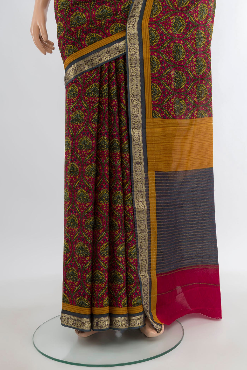 Pleats and pallu of Maroon Crepe Saree with Floral Print on the body and Zari Border. 