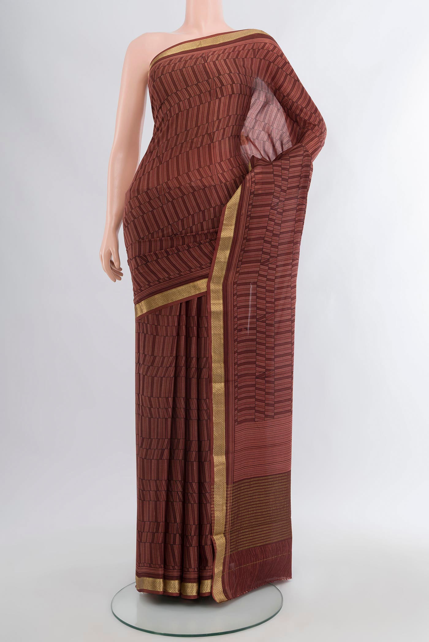Coffee Brown Mysore Crepe Saree with Printed design on the body and Zari Border.  displayed on a mannequin