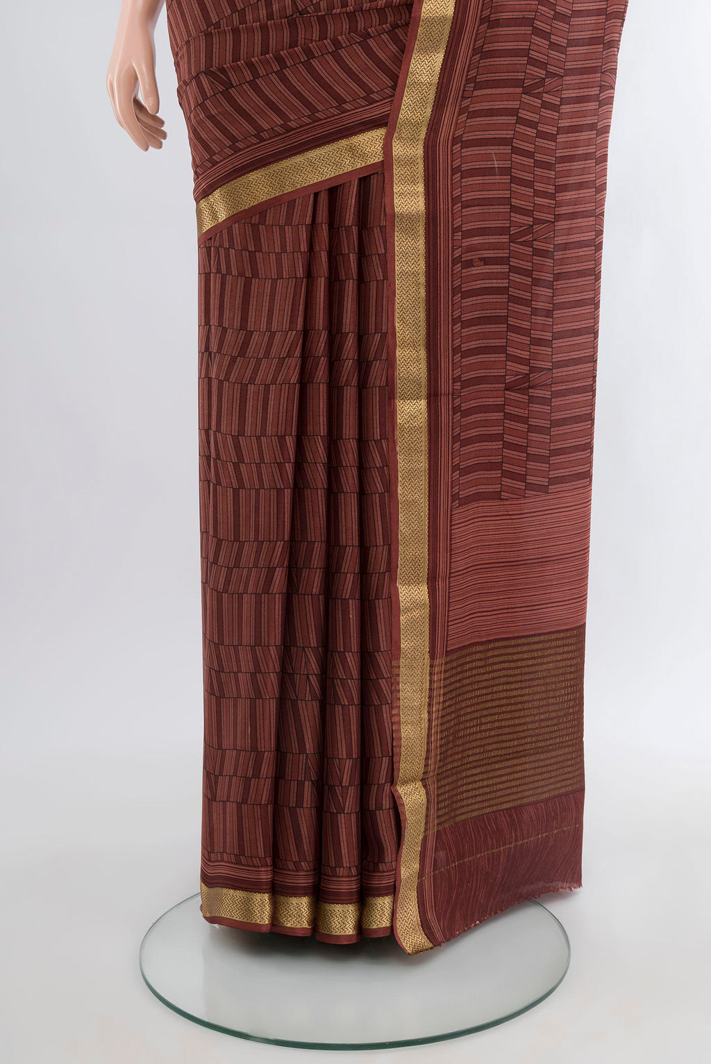 Pleats and pallu of Coffee Brown Mysore Crepe Saree with Printed design on the body and Zari Border. 