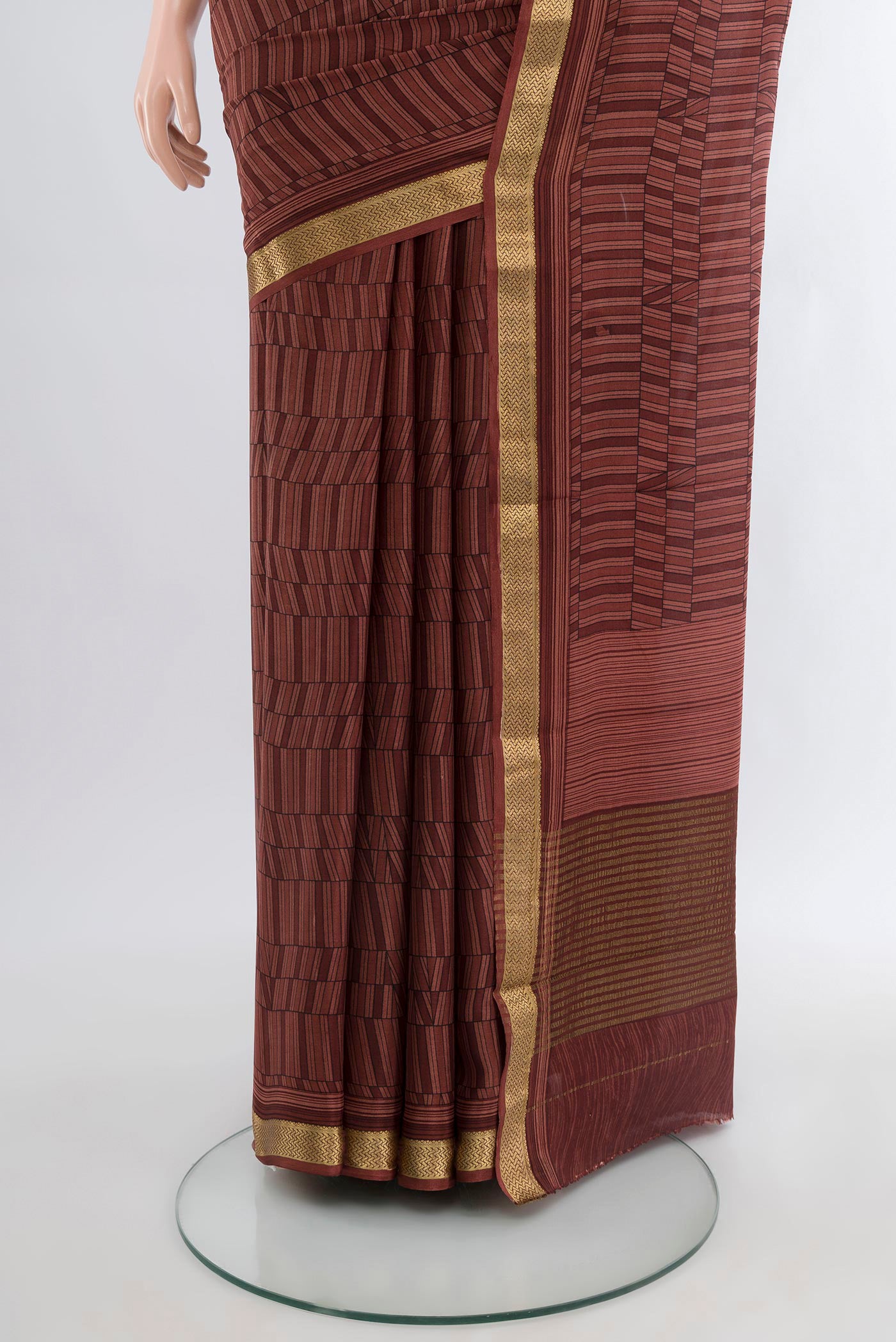 Pleats and pallu of Coffee Brown Mysore Crepe Saree with Printed design on the body and Zari Border. 