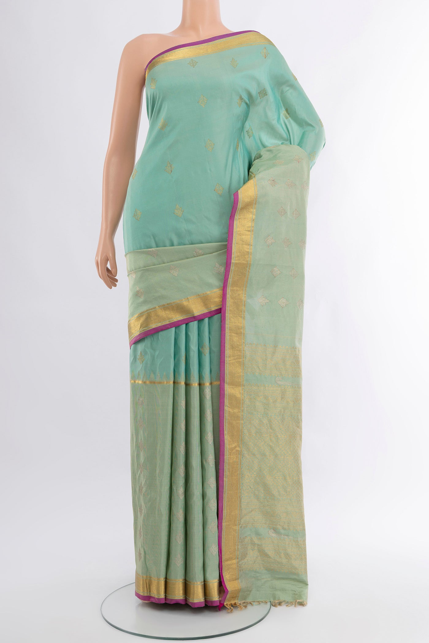 Sky Blue Gadwal Silk Saree with Zari Butta on the body and Zari Border.  displayed on a mannequin