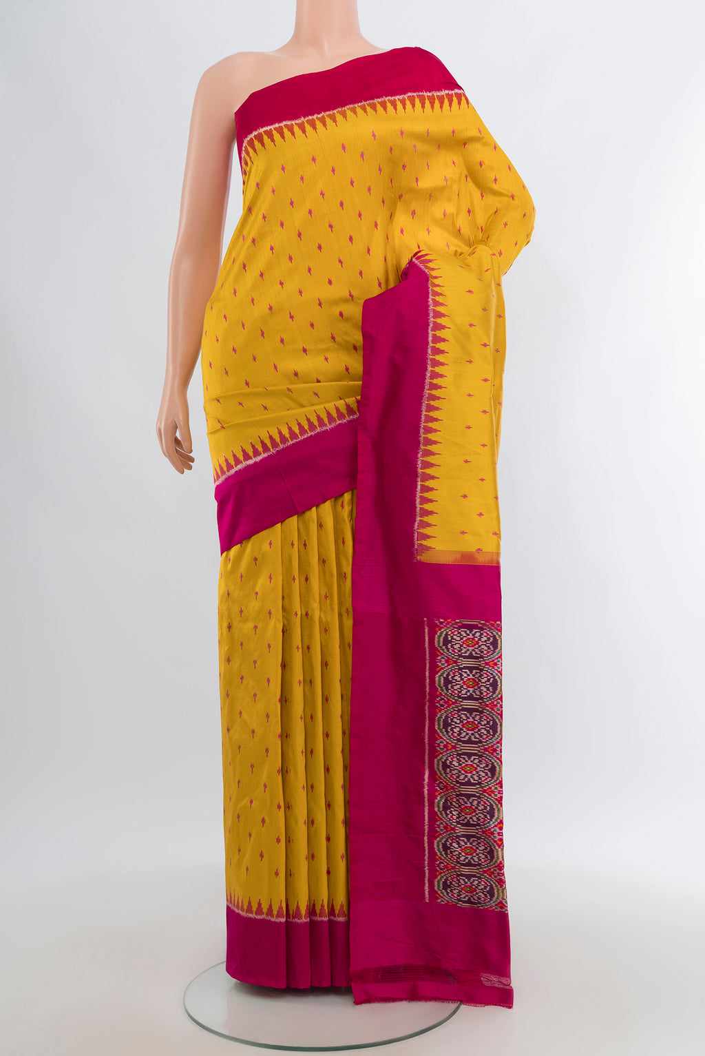 Yellow Pochampally Silk Saree with Ikat design on the body and Plain Border.  displayed on a mannequin