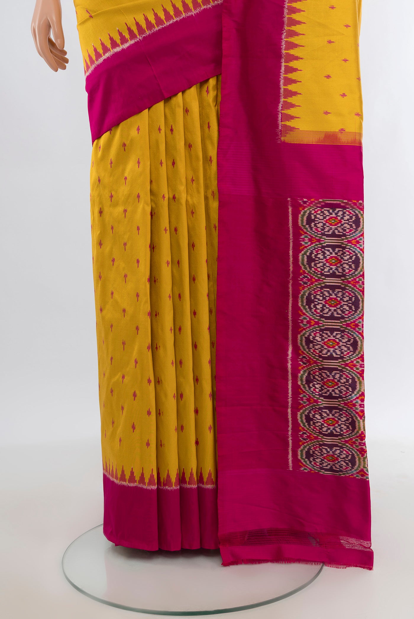 Pleats and pallu of Yellow Pochampally Silk Saree with Ikat design on the body and Plain Border. 