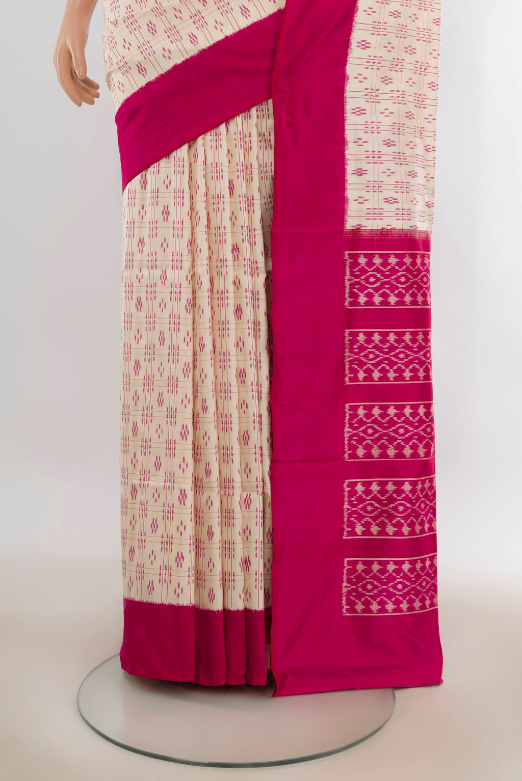 Pleats and pallu of Pure Silk Cream Pochampally Saree with Pure Ikat on the body and Plain Border. 