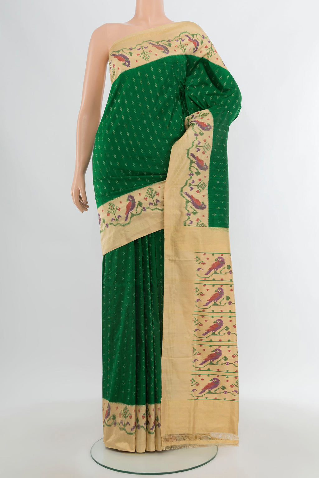 Green Pochampally Silk Saree with Pure Ikat on the body and Zari Border.  displayed on a mannequin
