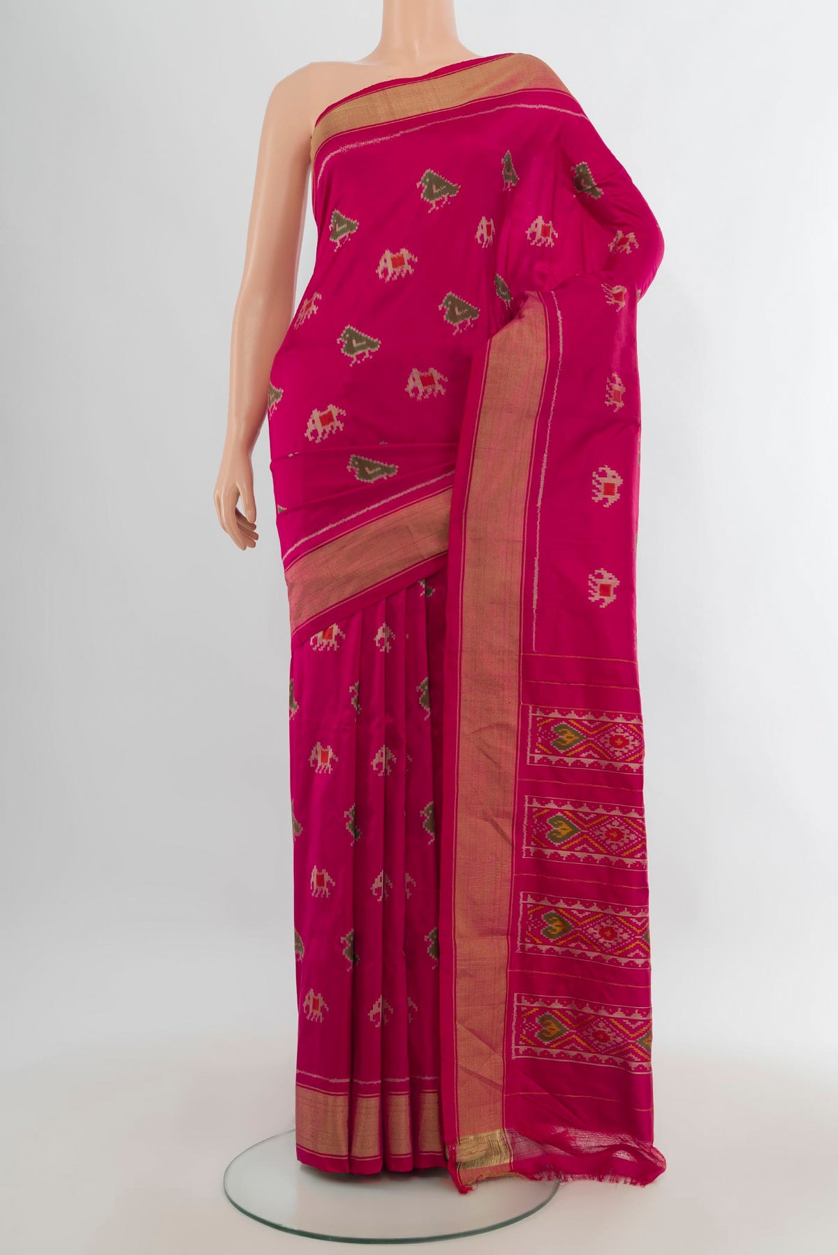 Pure Silk Dark Pink Pochampally Saree with Pure Ikat on the body and Zari Border.  displayed on a mannequin