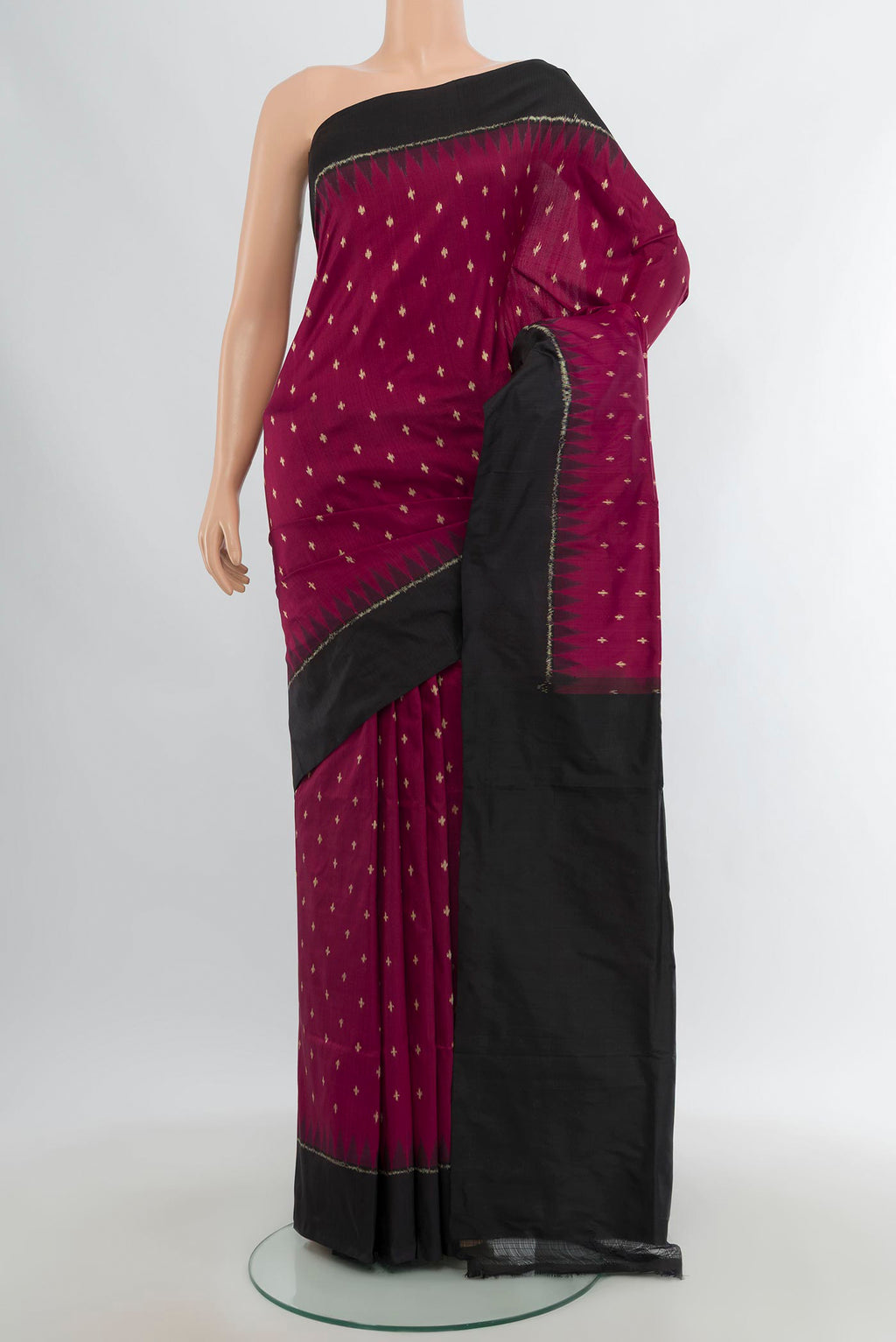 Maroon Pochampally Silk Saree with Pure Ikat on the body and Plain Border.  displayed on a mannequin