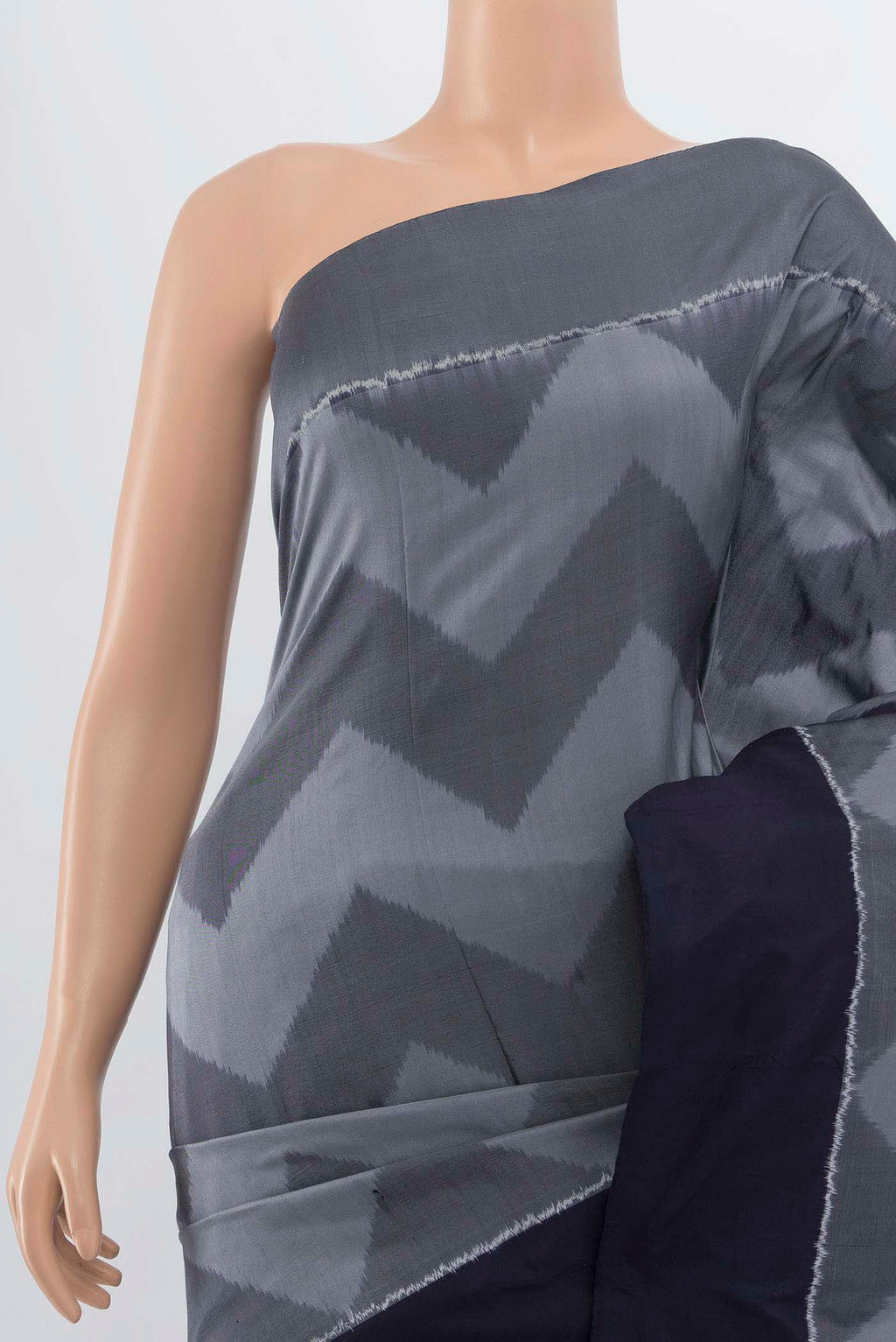 Border image of Grey Pochampally Saree with Ikat Print on the body and Silk Border. 