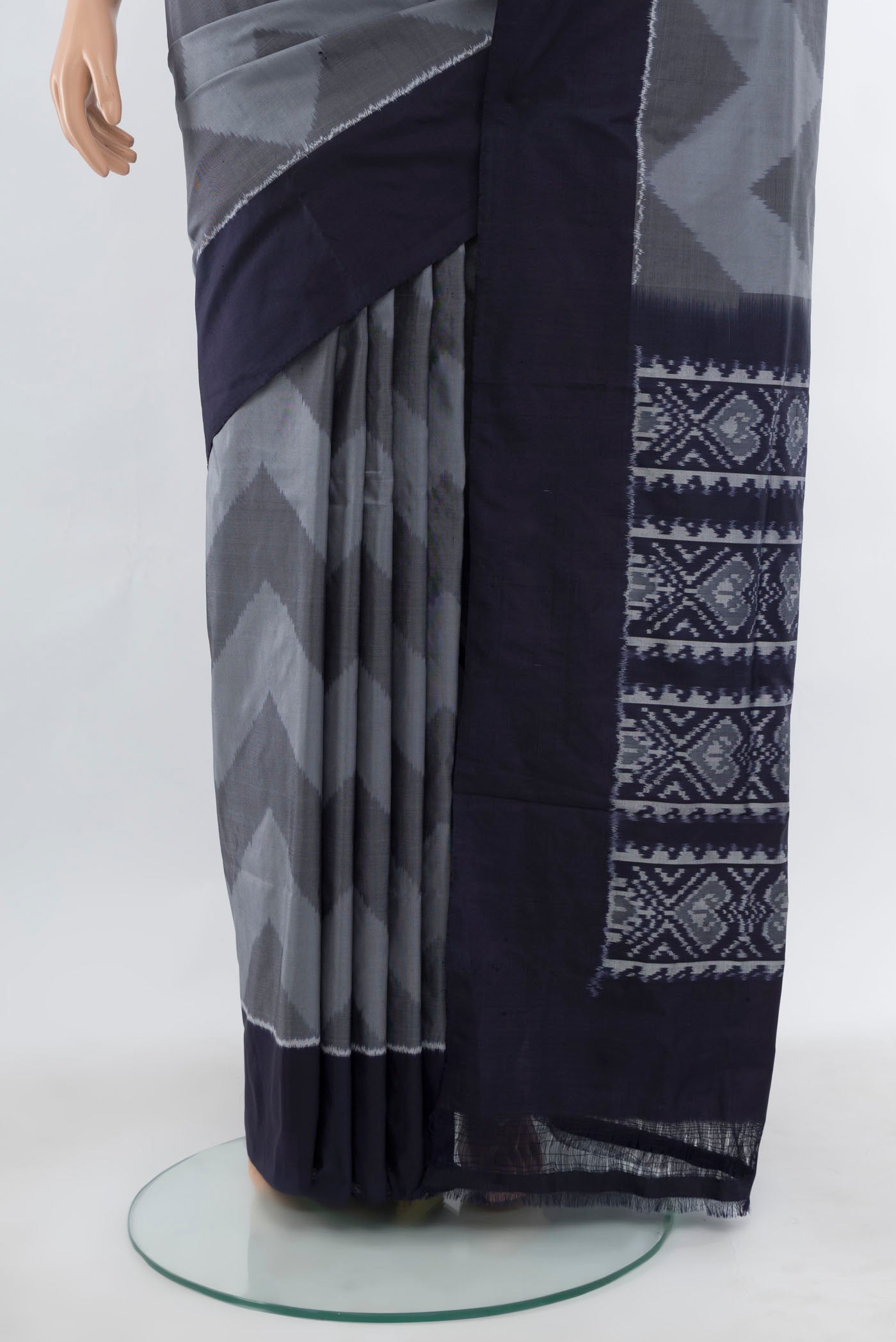 Pleats and pallu of Grey Pochampally Saree with Ikat Print on the body and Silk Border. 