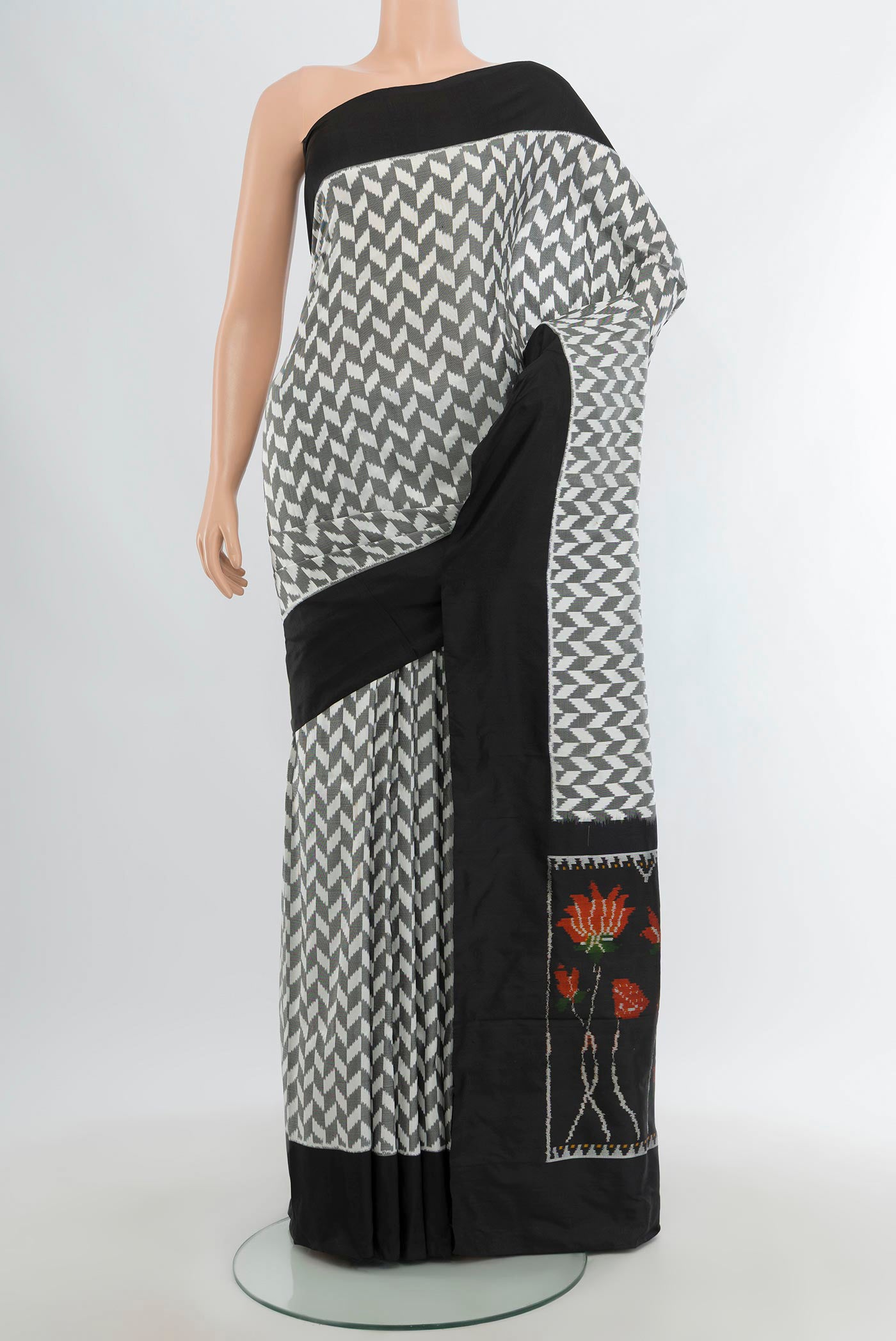 Multi Color Pochampally Silk Saree with Pure Ikat on the body and Plain Border.  displayed on a mannequin