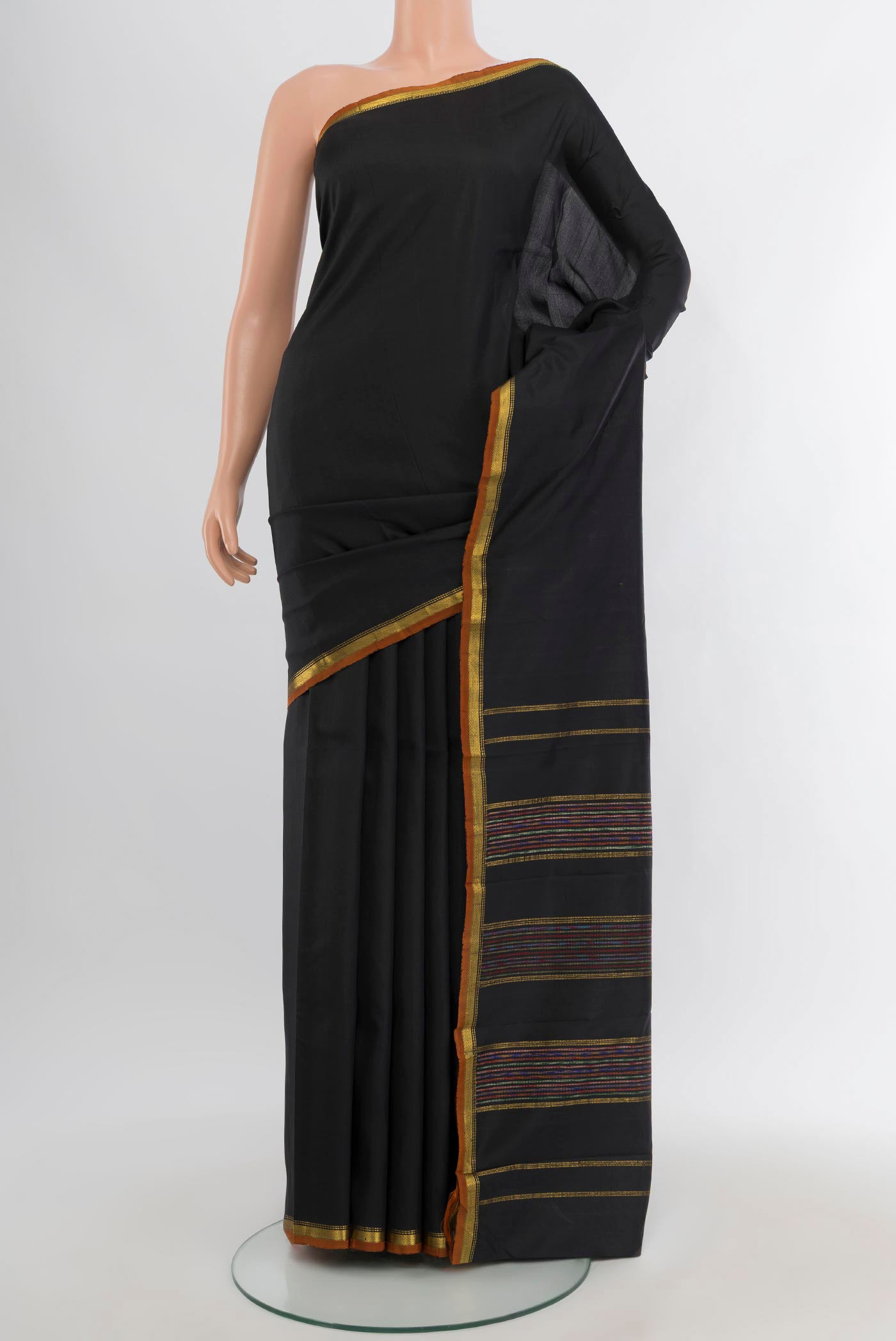 Black Kanchipuram Silk Saree with Plain Body and Zari Border.  displayed on a mannequin