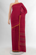 Maroon Kanchipuram Silk Saree with Plain Body and Zari Border.  displayed on a mannequin