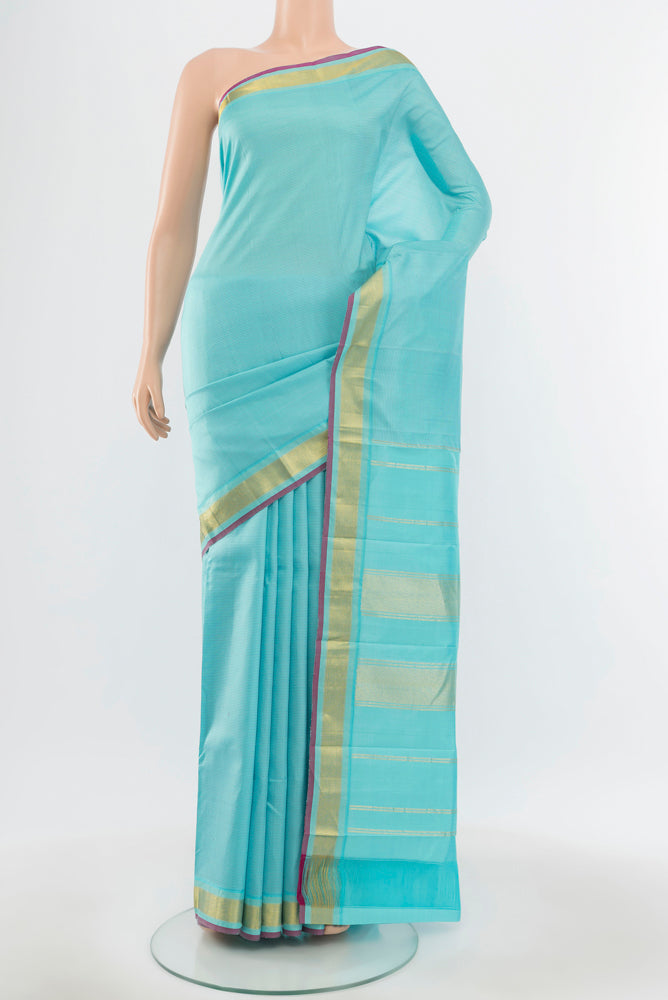 Pure Silk Pure Zari Sky Blue Kanchipuram Saree with Zari Butta on the body and Silk Border.  displayed on a mannequin